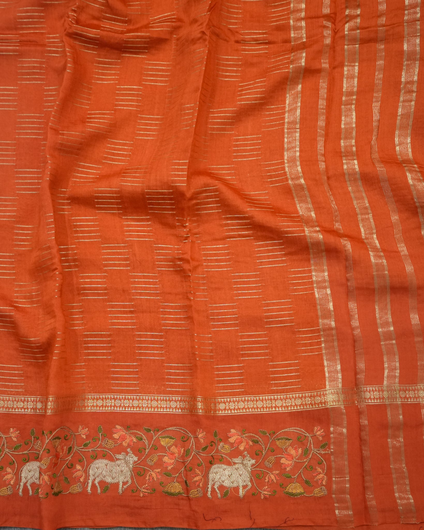 Soft Tussar Orange Premium Saree with Zari Work & Pichwai Embroidered Border